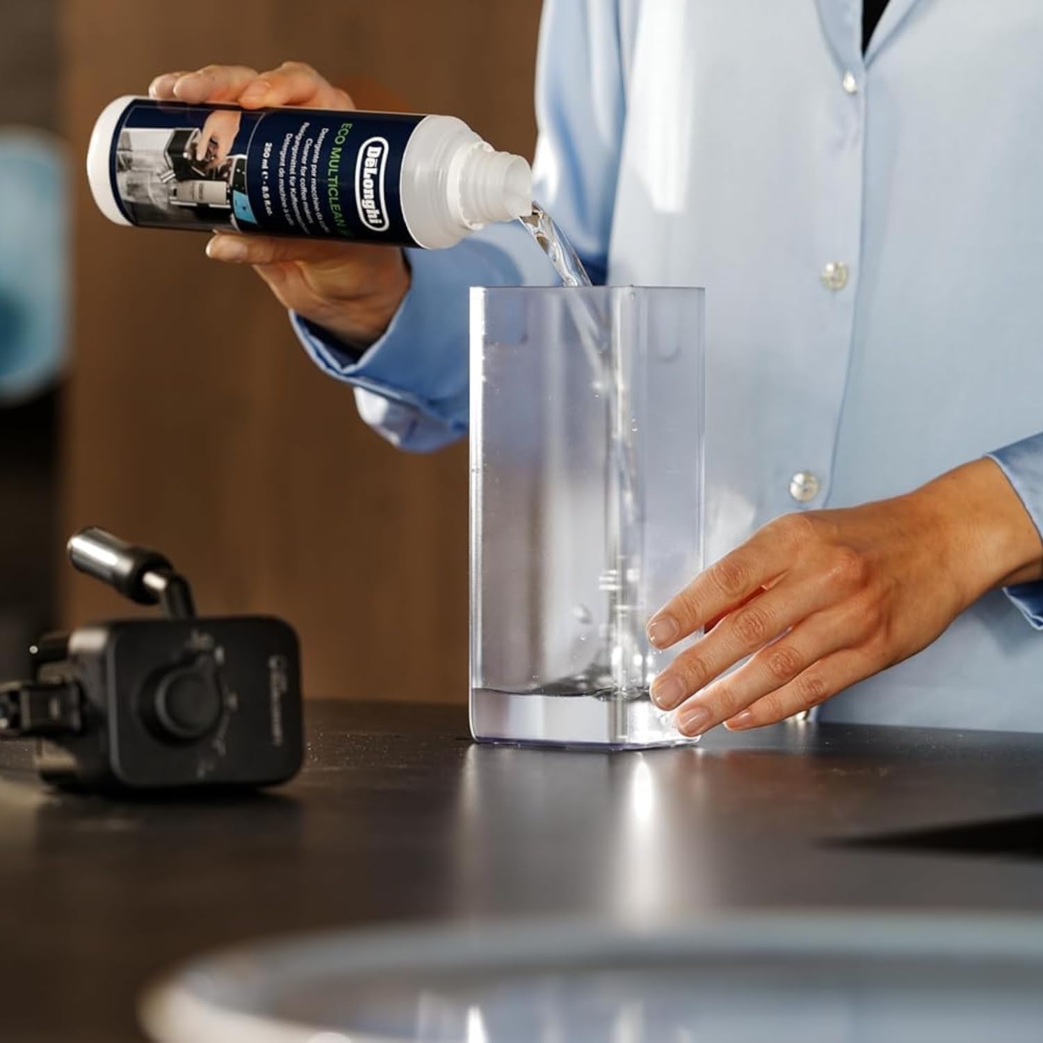 De'Longhi milk carafe cleaner helps sanitize frother nozzles and prevent clogs.