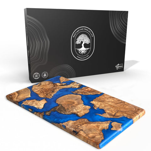 Designium olive wood resin cutting board showing natural grain with blue resin river for stylish serving