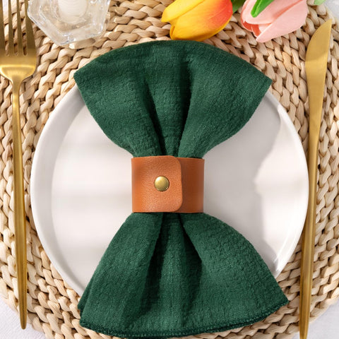 DeZerlor emerald-green napkins showcase decorative folding ideas for decor.