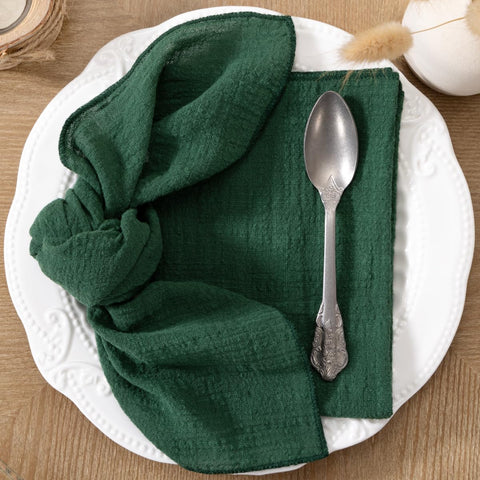 DeZerlor napkins folded into a rose shape for wedding reception decor.