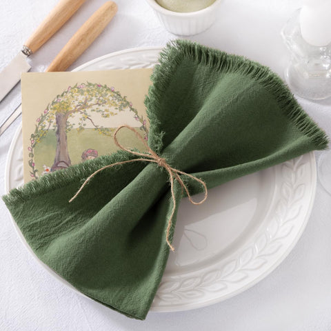 DeZerlor napkins on dining table show durable, absorbent fabric in use.