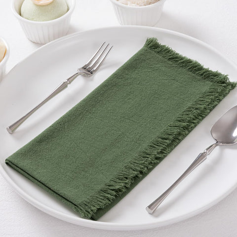 DeZerlor olive-green napkins with fringe edges add rustic charm and reusable elegance.