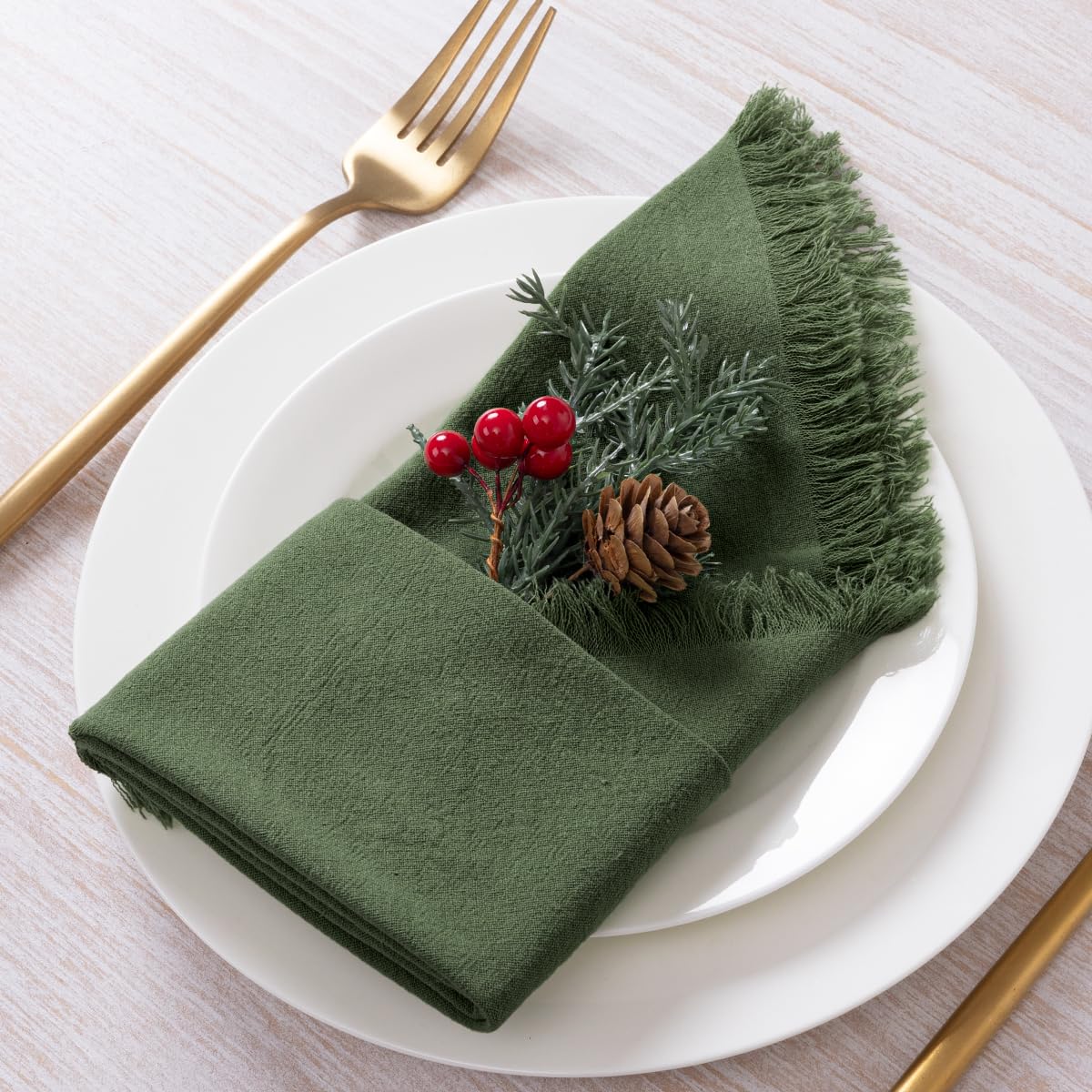 DeZerlor wedding table decor with olive-green napkins for cohesive styling.