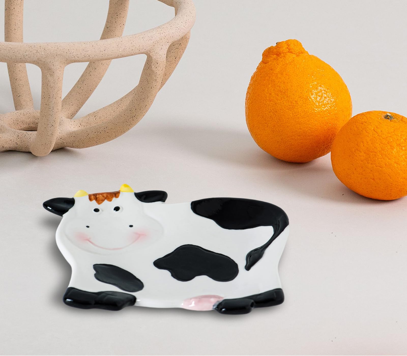 dgudgu Cow Shaped Spoon Rest on stovetop keeps spoons handy while cooking.