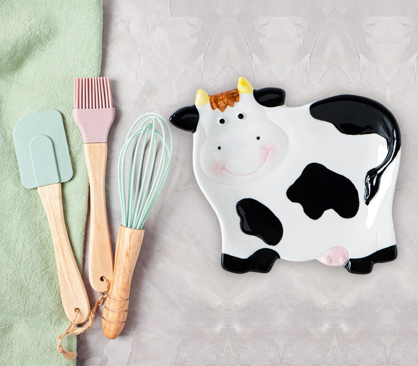 dgudgu Cow Shaped Spoon Rest side view shows durable ceramic and design.