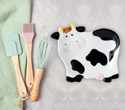 dgudgu Cow Shaped Spoon Rest side view shows durable ceramic and design.