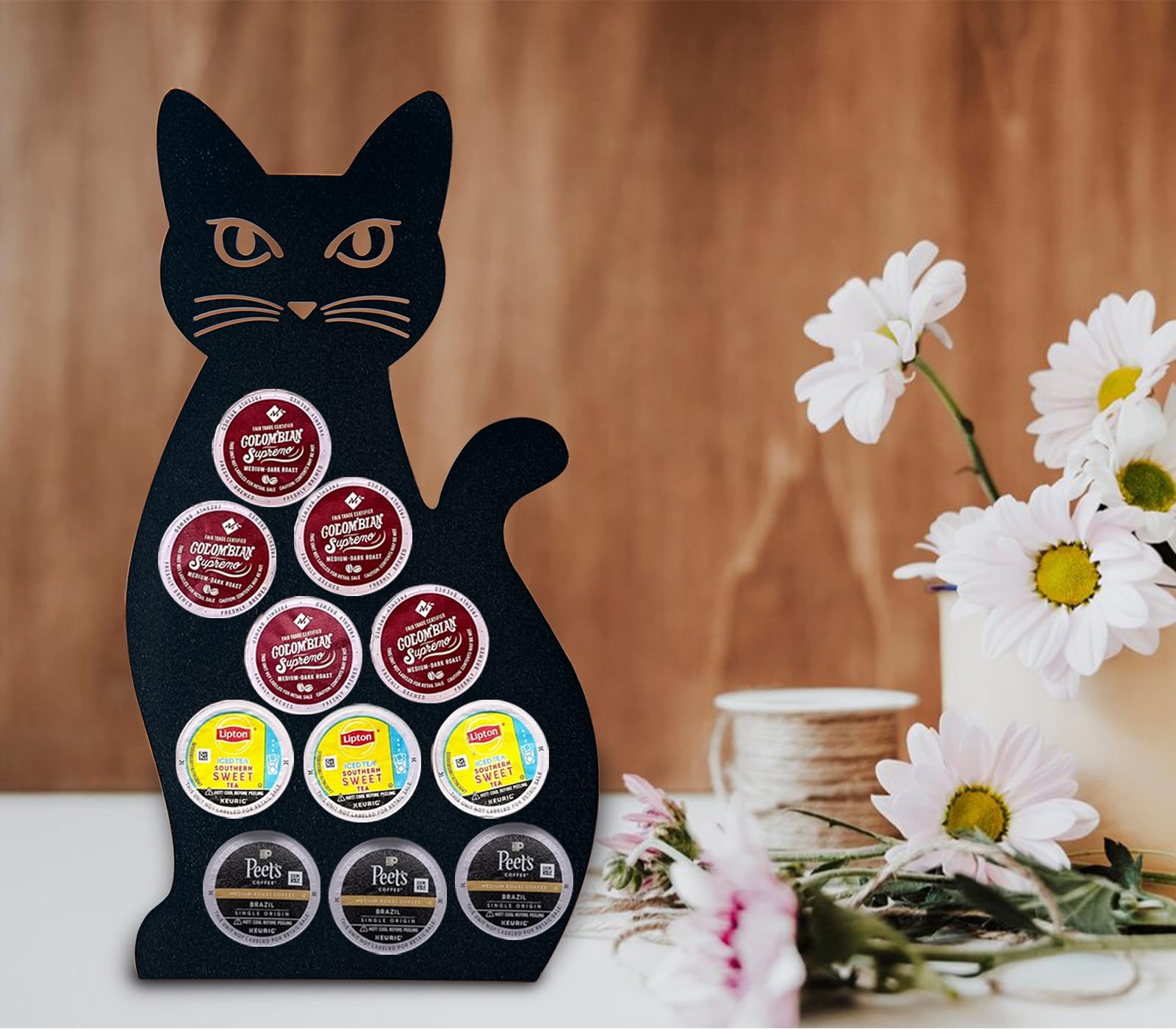 Two-piece cat coffee pod storage with laser-cut precision.