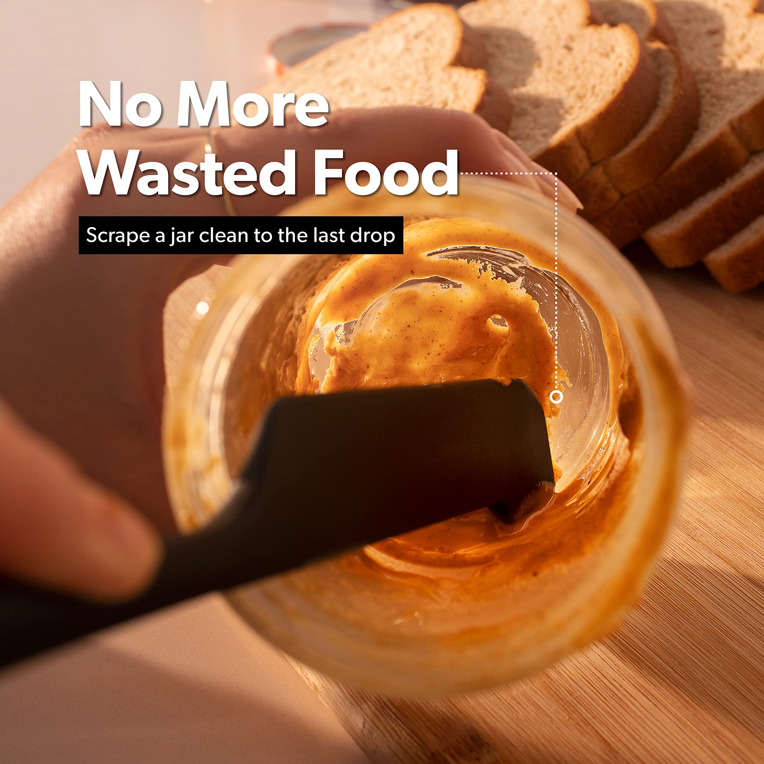 Di Oro Living silicone spatulas in a bowl, demonstrating effective scraping.