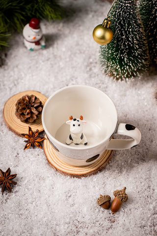 DIHOclub mug shows bottom reveal cow as you sip tea.