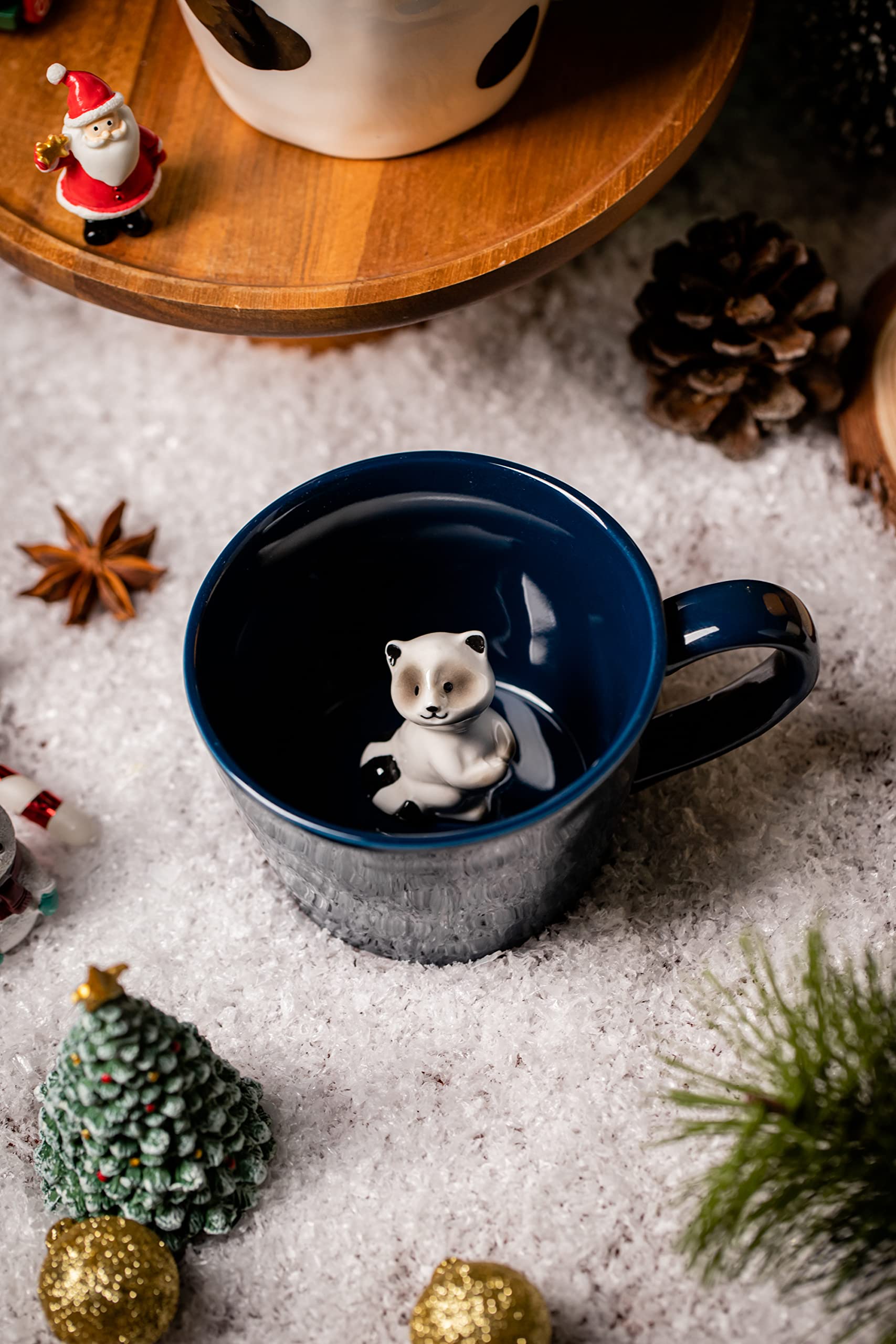 DIHOclub Racoon mug smiling peek, adds whimsy to tea or hot chocolate.