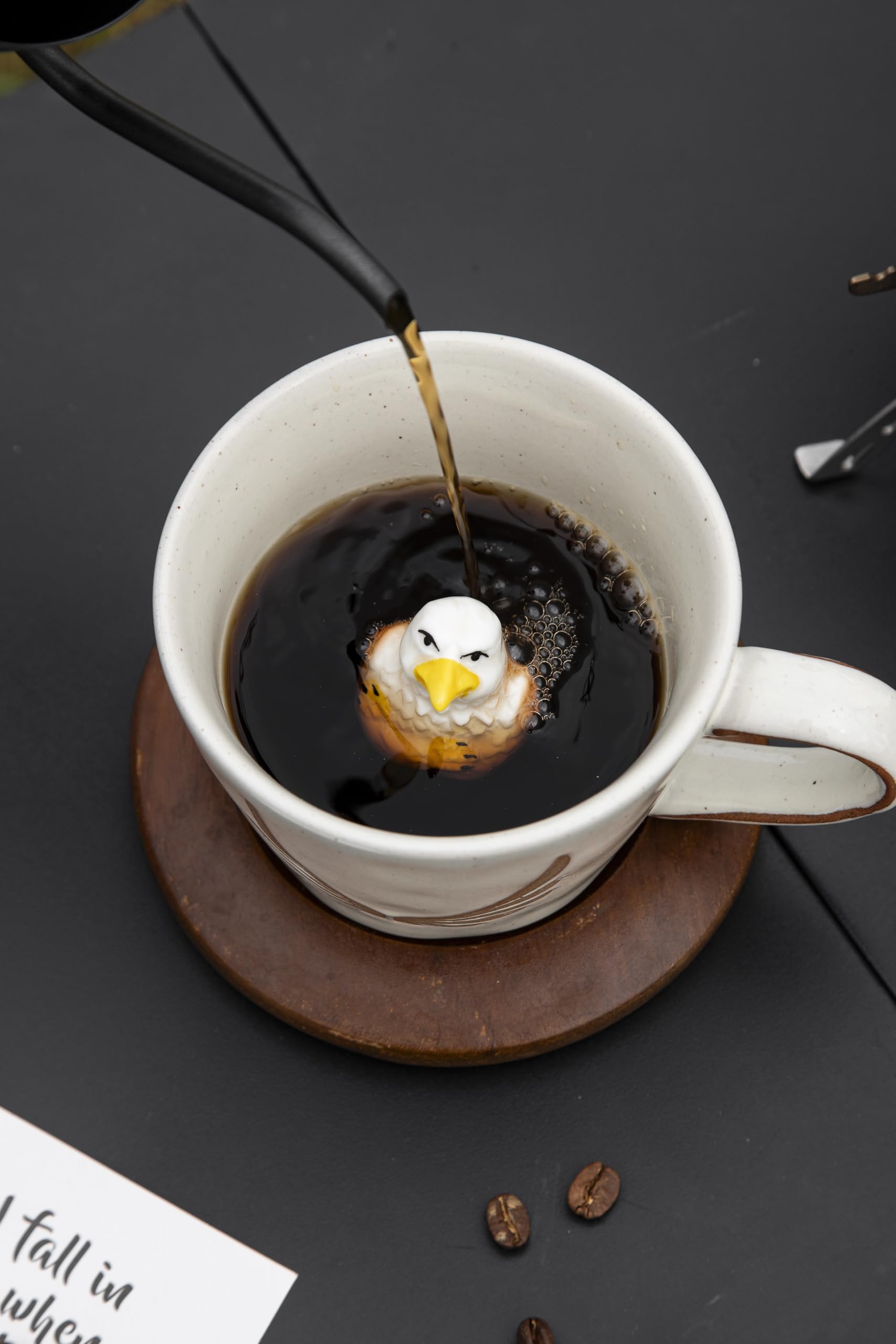 DIHOclub animal-figurine mug perched on rim adds whimsy.