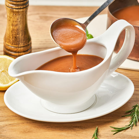 Dinnerlit gravy boat with ergonomic handle for comfortable grip.