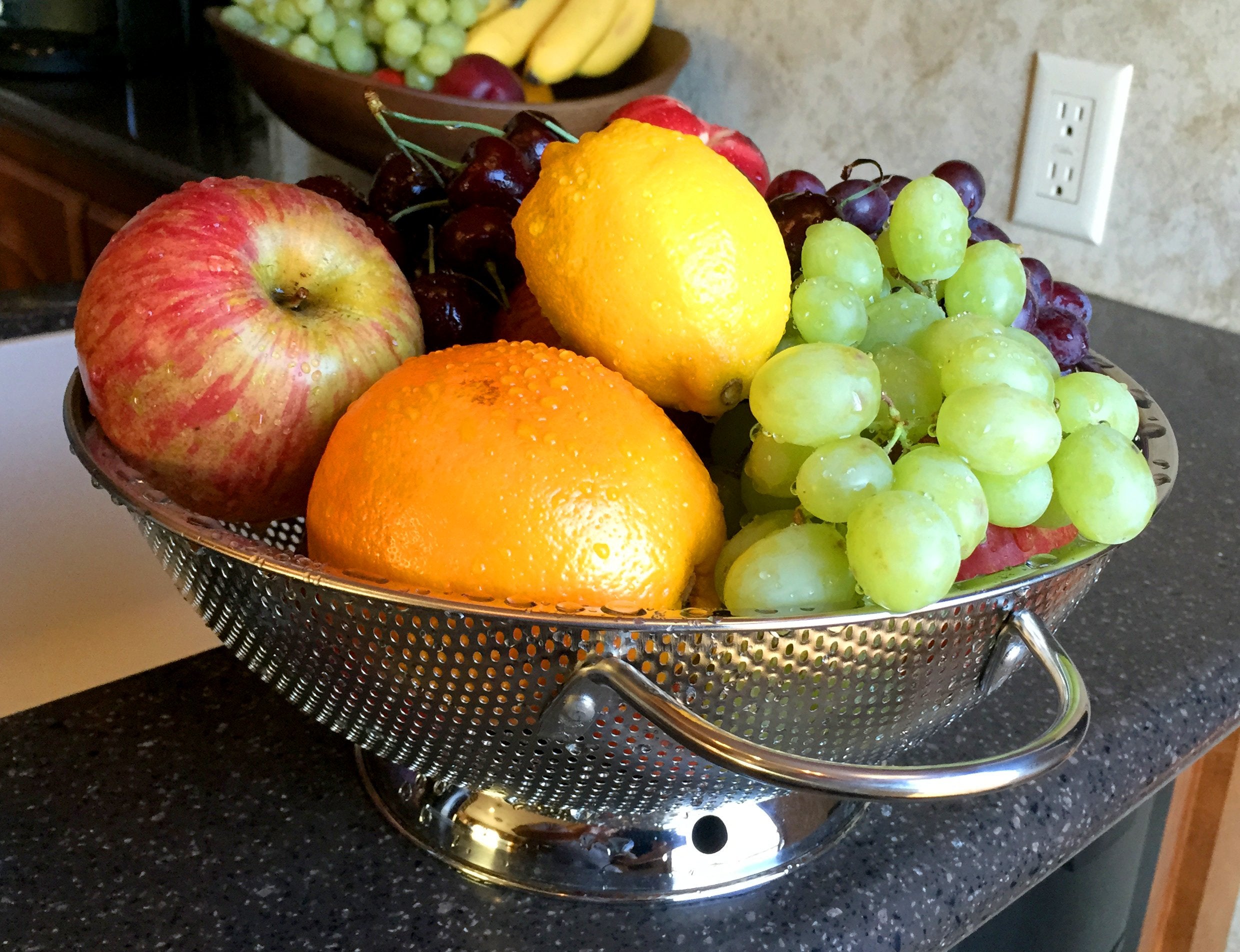 DLD stainless steel pasta colander for rinsing noodles.