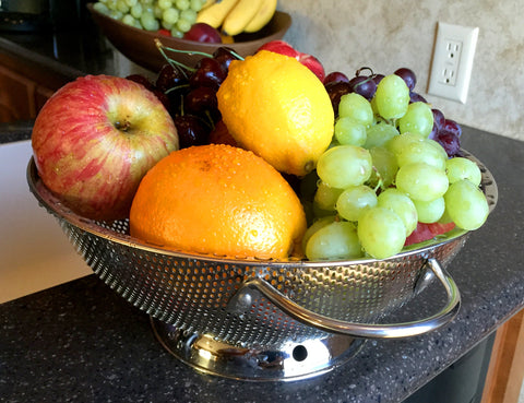 DLD stainless steel pasta colander for rinsing noodles.
