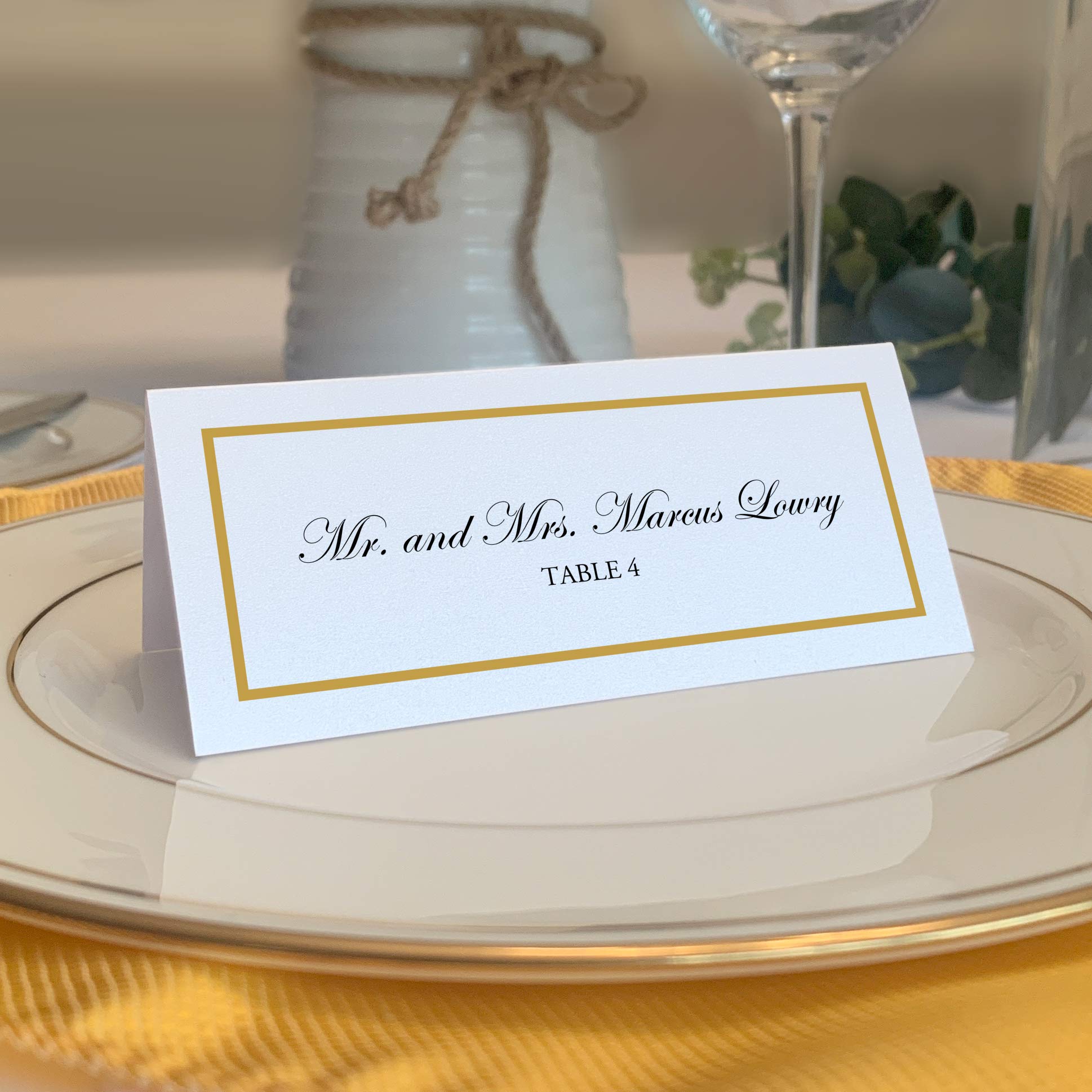 Documents and Designs gold border place cards stacked for easy setup at events
