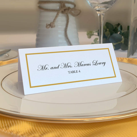 Documents and Designs gold border place cards stacked for easy setup at events