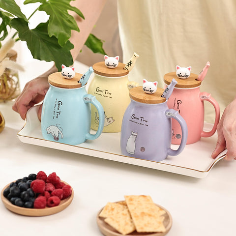 Two cat coasters protect surfaces while matching the mugs