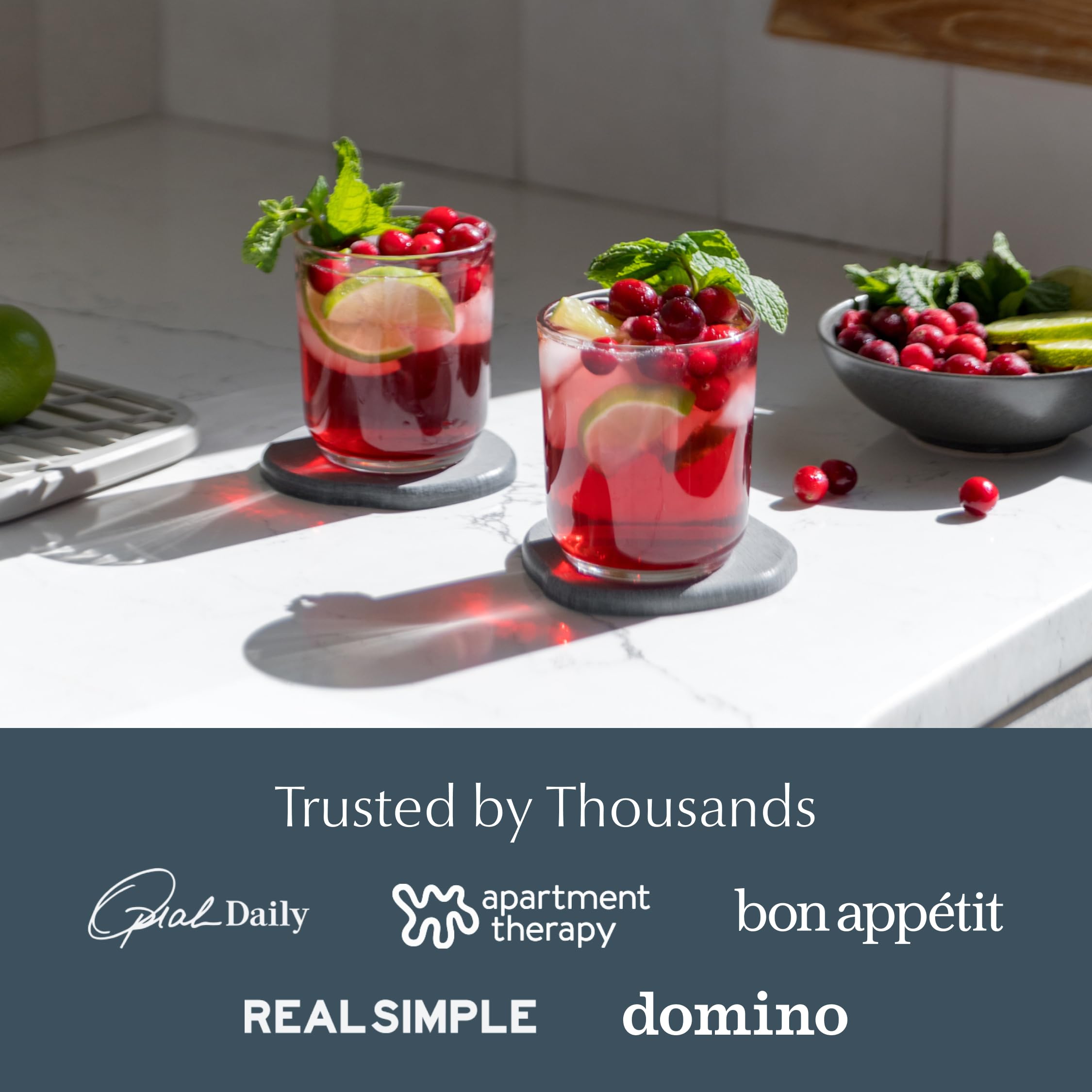 Dorai coaster set displayed in wood organizer enhances kitchen styling