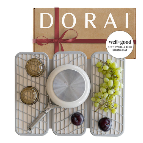 Dorai Dish Pad on counter with stone base and fast drying action.