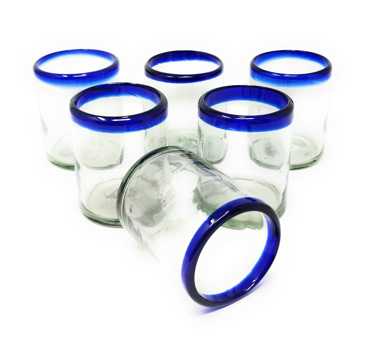 Dos Sueños hand-blown tumbler with cobalt rim, ideal for cocktails.