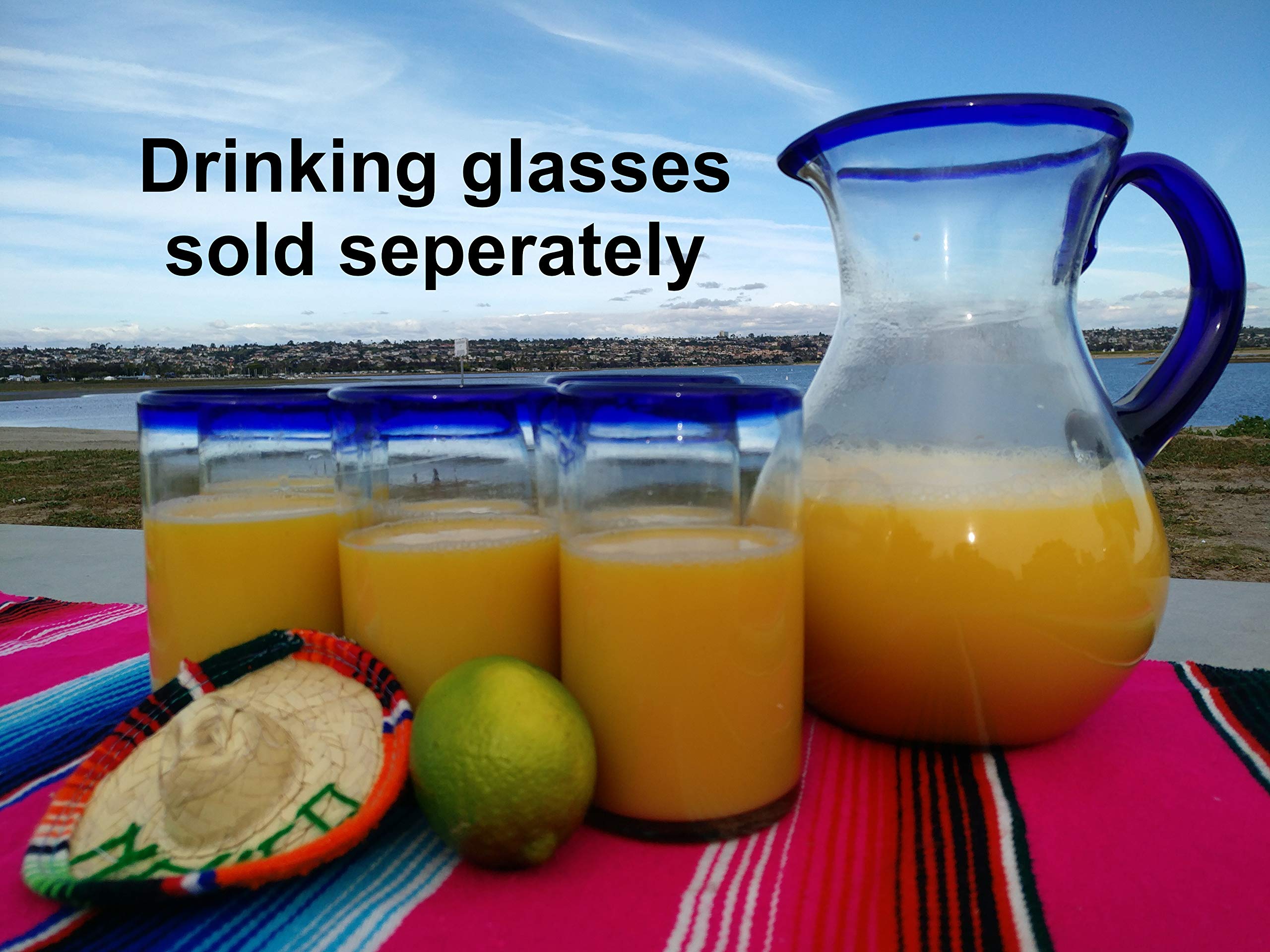 Eco-friendly recycled glass Dos Sueños pitcher, lead-free and dishwasher safe.