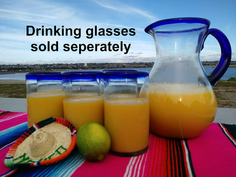 Eco-friendly recycled glass Dos Sueños pitcher, lead-free and dishwasher safe.