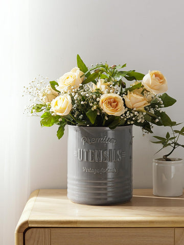 DOWAN grey ceramic utensil holder with cork mat protects surfaces.