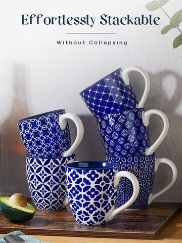 DOWAN mug shows weighted base, reduces tipping beside the computer.
