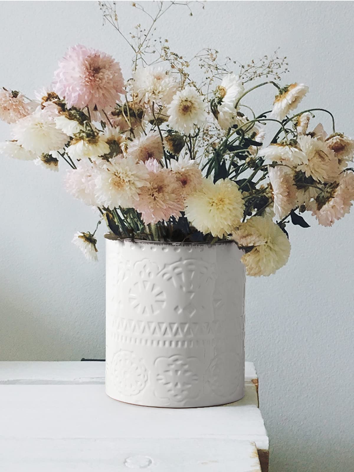 Dowan multi-use utensil holder doubles as planter or decorative vase.