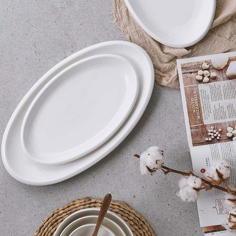 DOWAN off-white ceramic serving dish suitable for versatile entertaining trays.