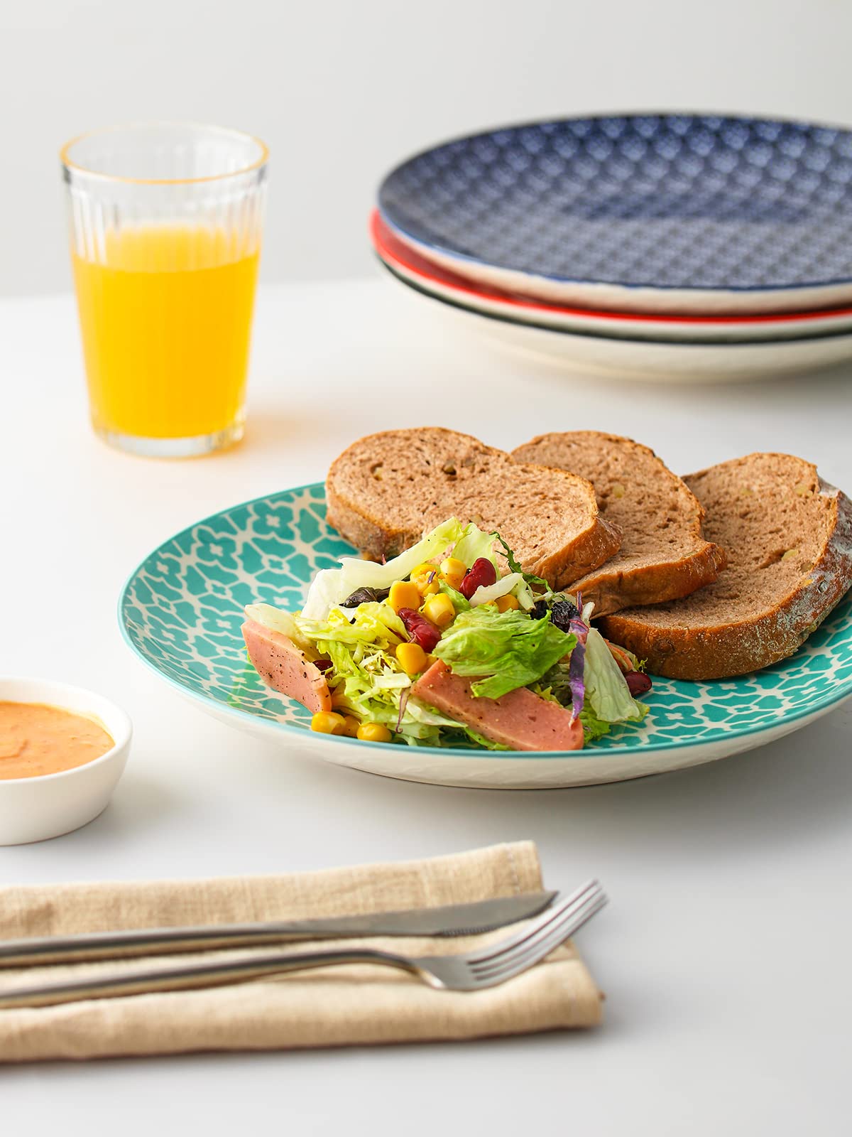 DOWAN plates stacked together show compact storage with style.