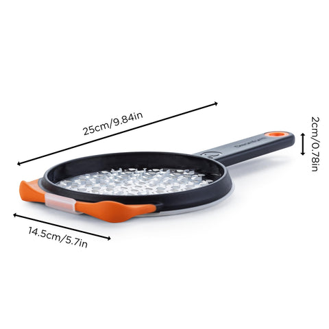 Dreamfarm Ograte bottom circular-motion blades enable quick grating of carrots and zucchini.
