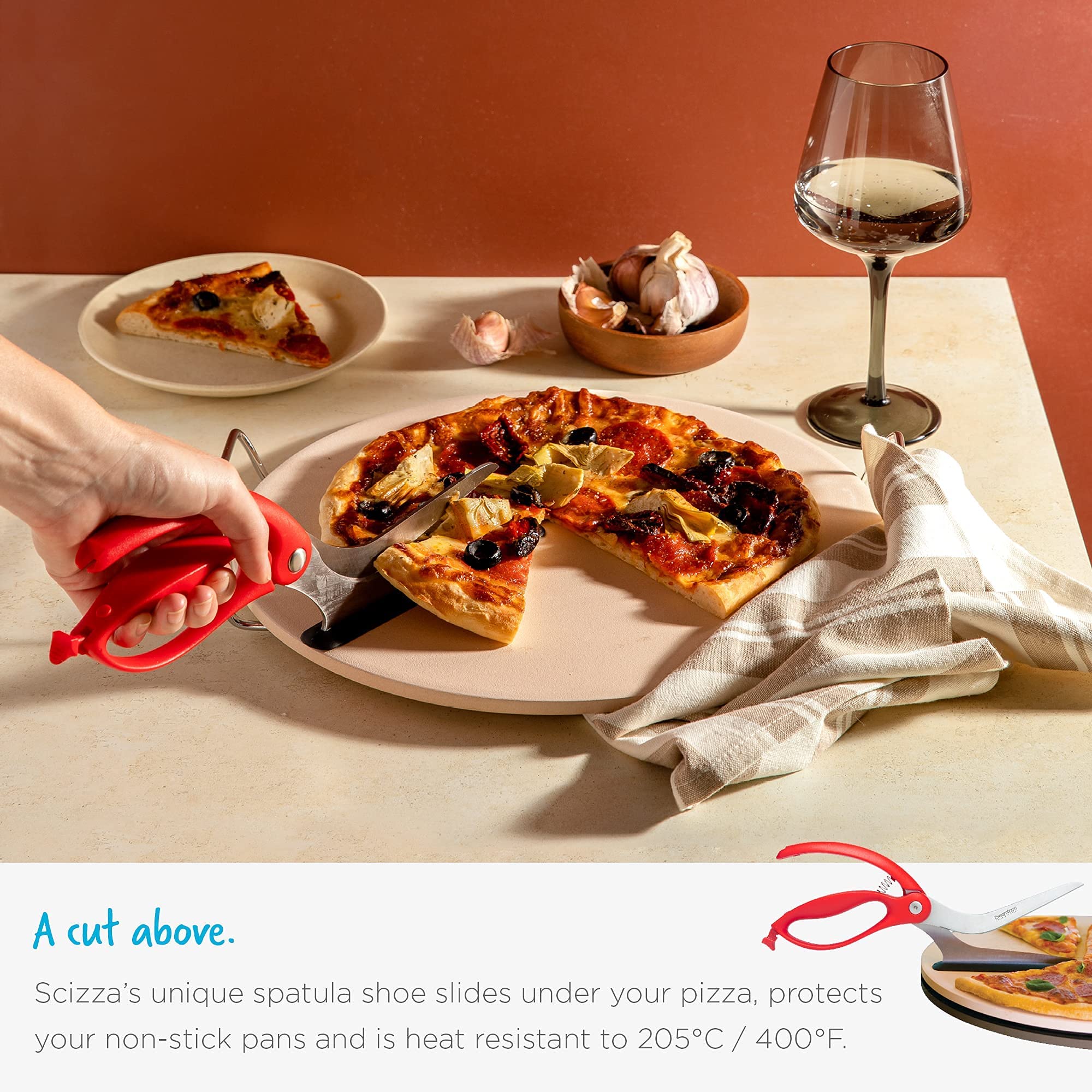 Dreamfarm Scizza spatula shoe slides under pizza to lift without mess.