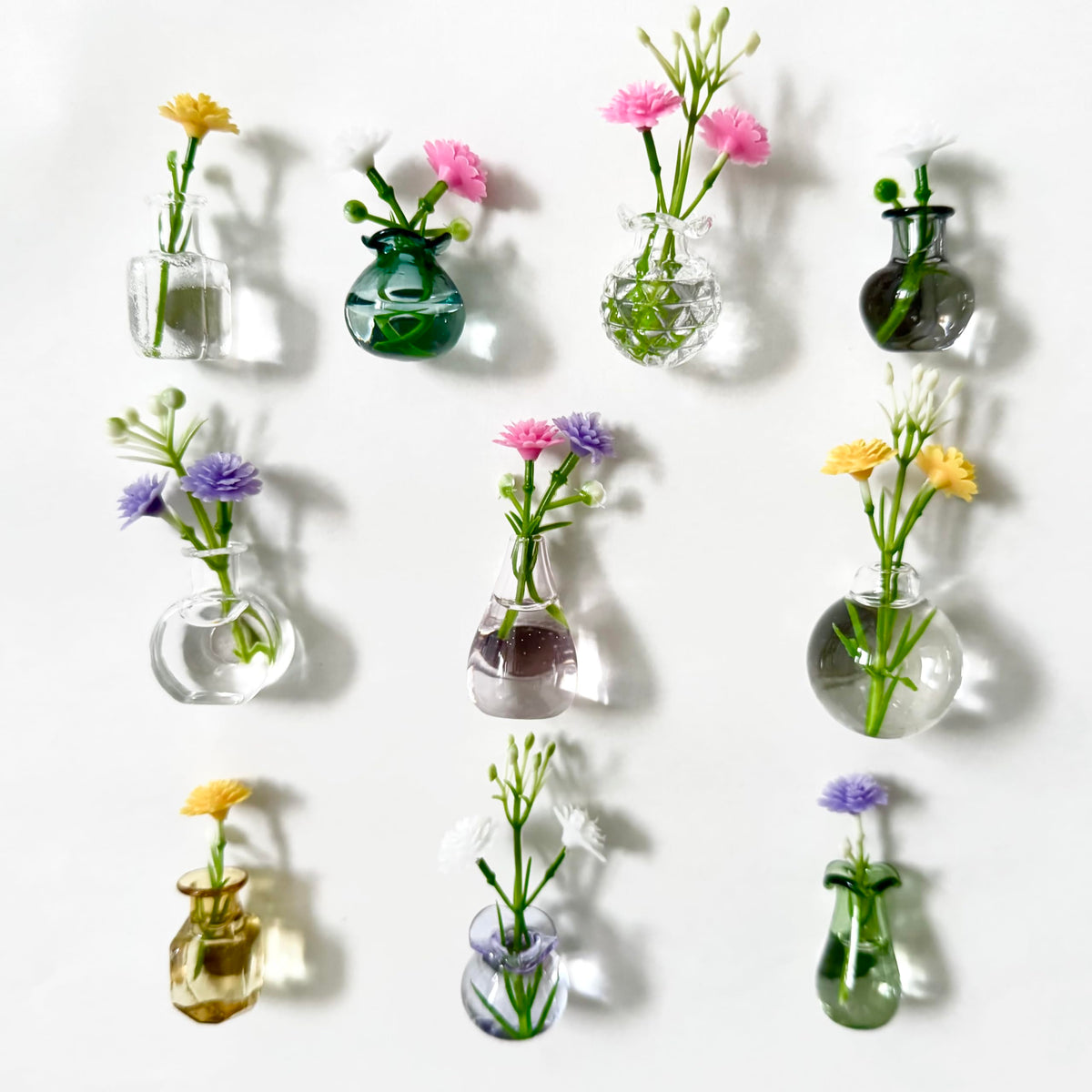 Dumpill mini vase magnets on fridge showing compact glass vases for notes and decor