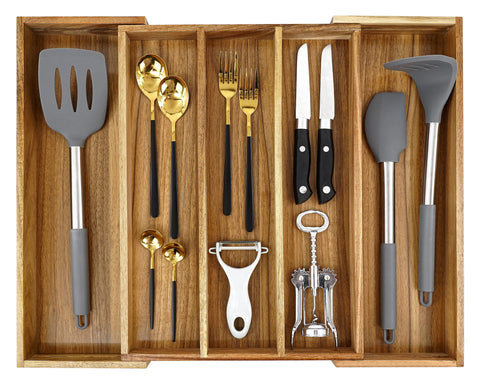 EcoFives Luxury Acacia Silverware Organizer in a drawer with grooved dividers for easy access.