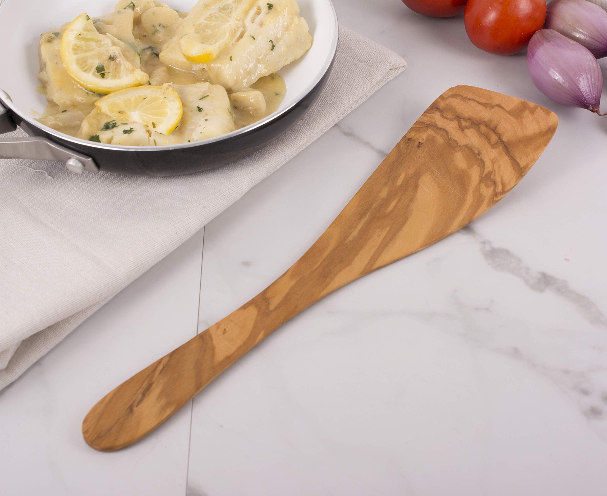 Eddingtons olive wood wide spatula in hand for versatile cooking and serving