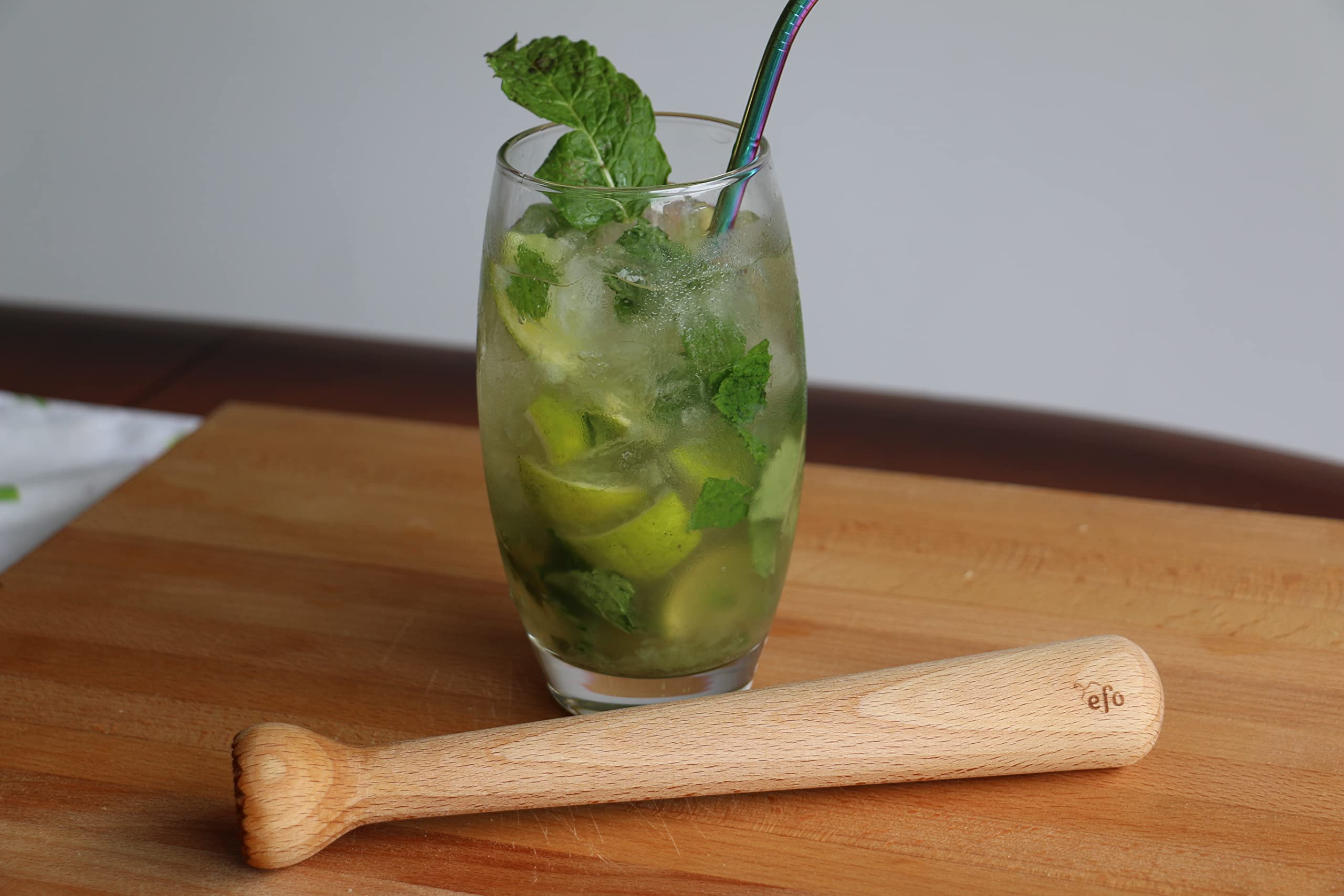 EFO muddler in a mint mojito scene, efficiently crushing mint and lime for fresh flavor