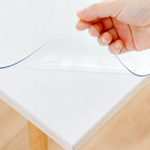 Eisdroma clear table cover protector on a desk mat protects surfaces from spills and scratches