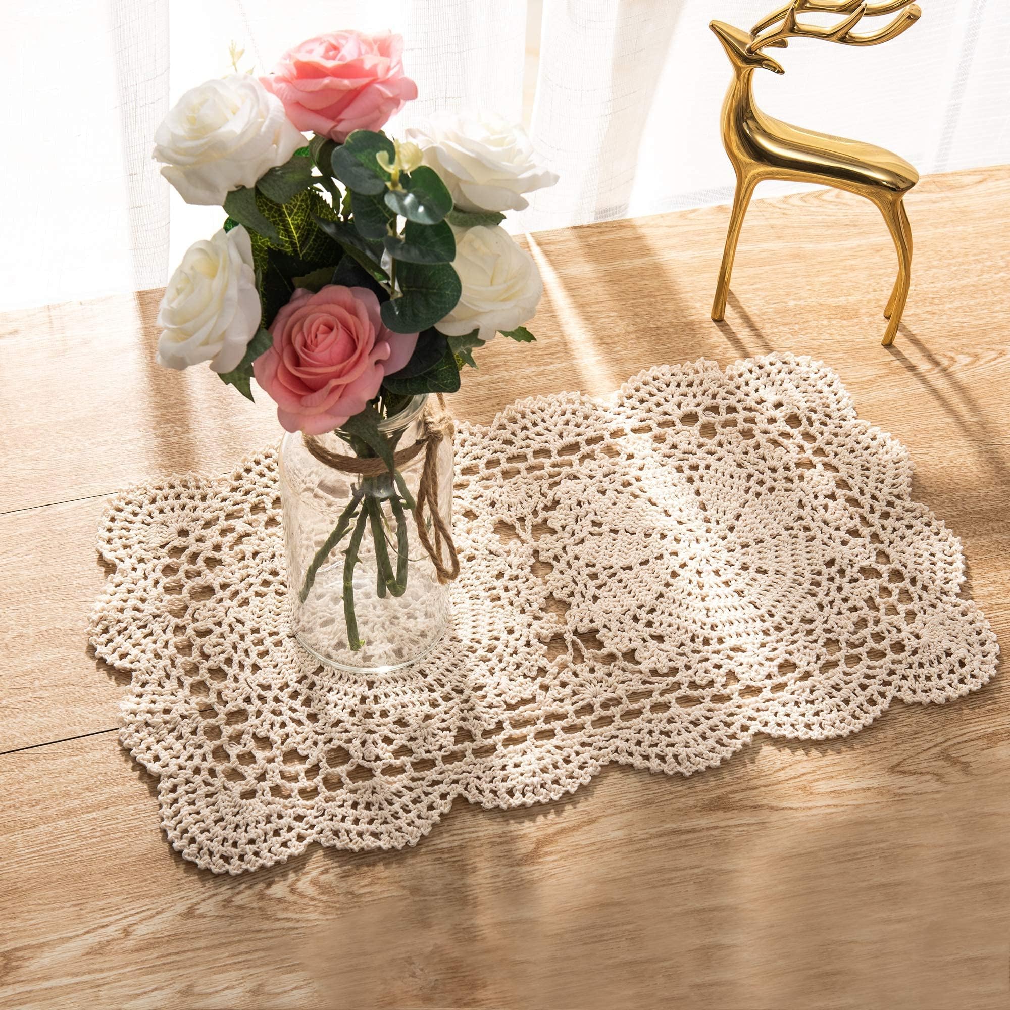 Eiyye crochet doilies used as coasters for cups and glasses, protecting surfaces.
