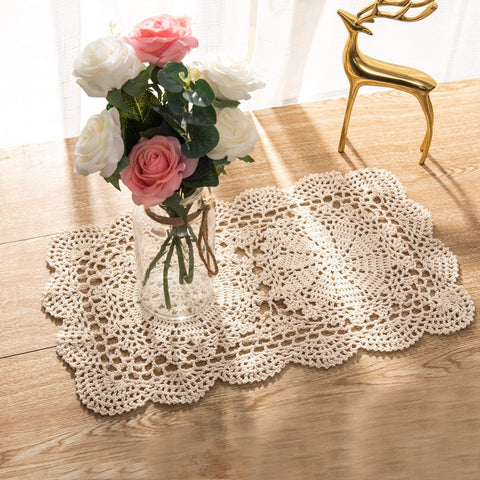Eiyye crochet doilies used as coasters for cups and glasses, protecting surfaces.