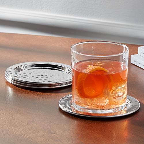 Elegance hammered coasters used as pillar candle holders on a table setting.