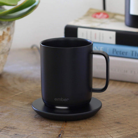 Ember Charging Coaster 2 charges travel mug for on-the-go warmth