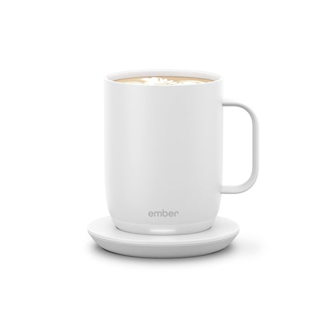 Ember Mug 2 on desk maintaining ideal warmth for long work sessions.
