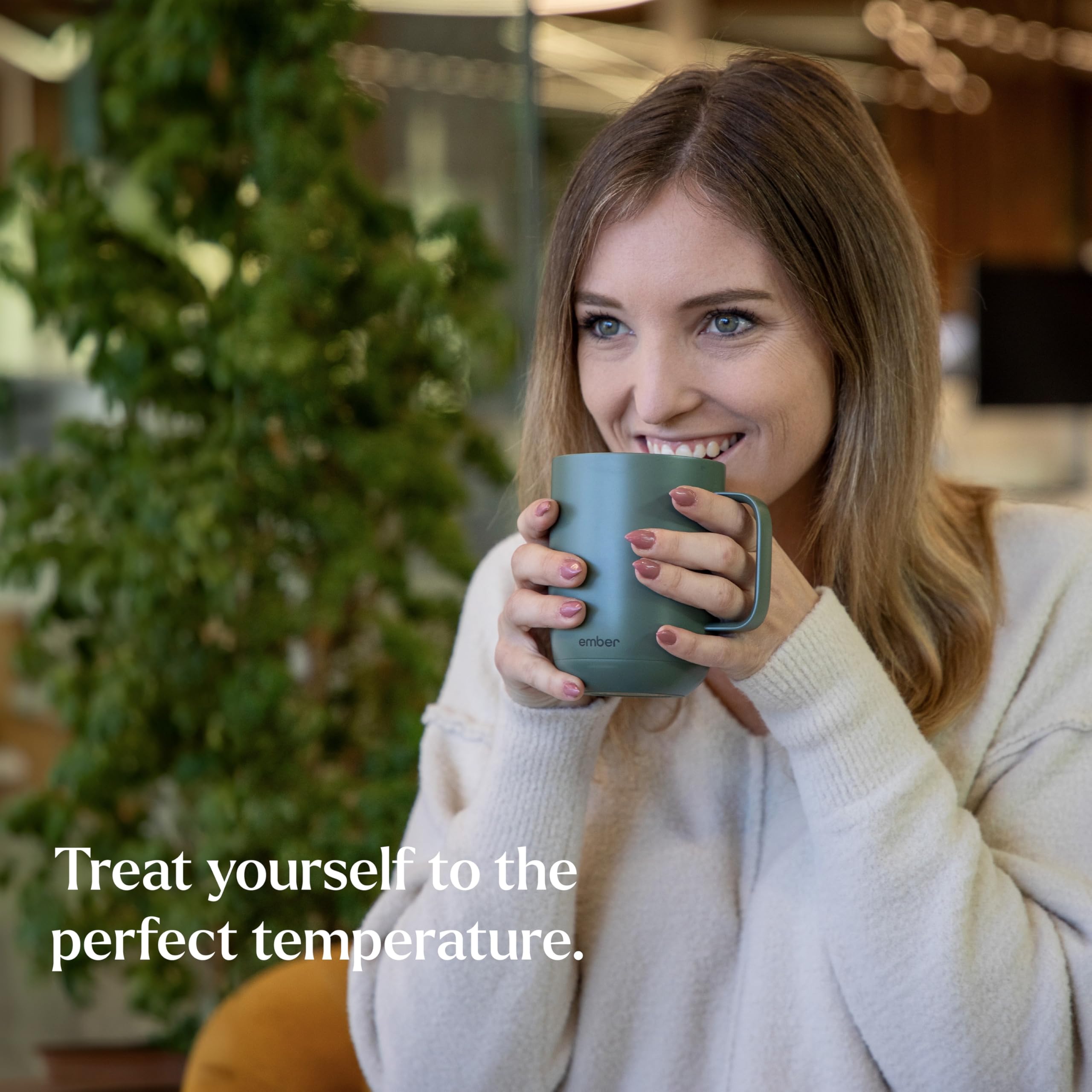 Ember Mug 2 sage green on-desk use showing portable warmth