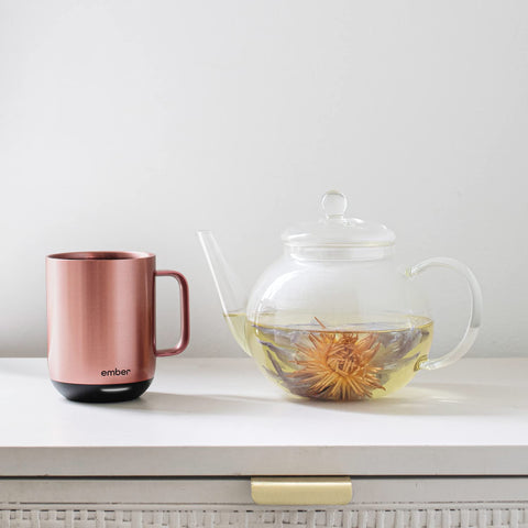 Ember Sipping Lid in use on the go for convenient sipping