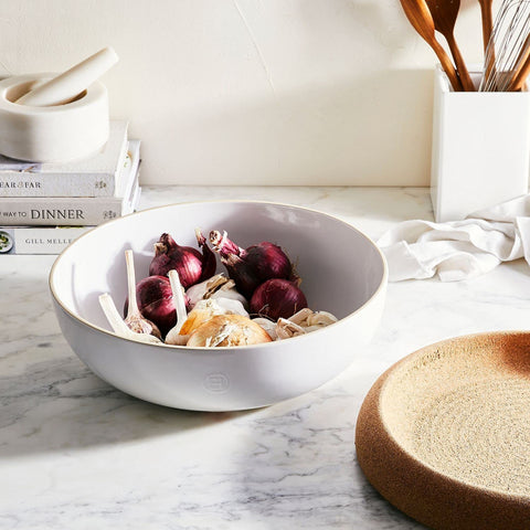 Emile Henry on-counter storage for potatoes, onions, and unripened fruit