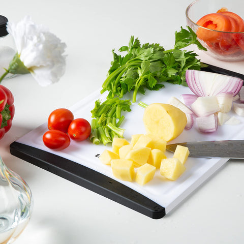 Empune black cutting boards stacked neatly on a kitchen counter