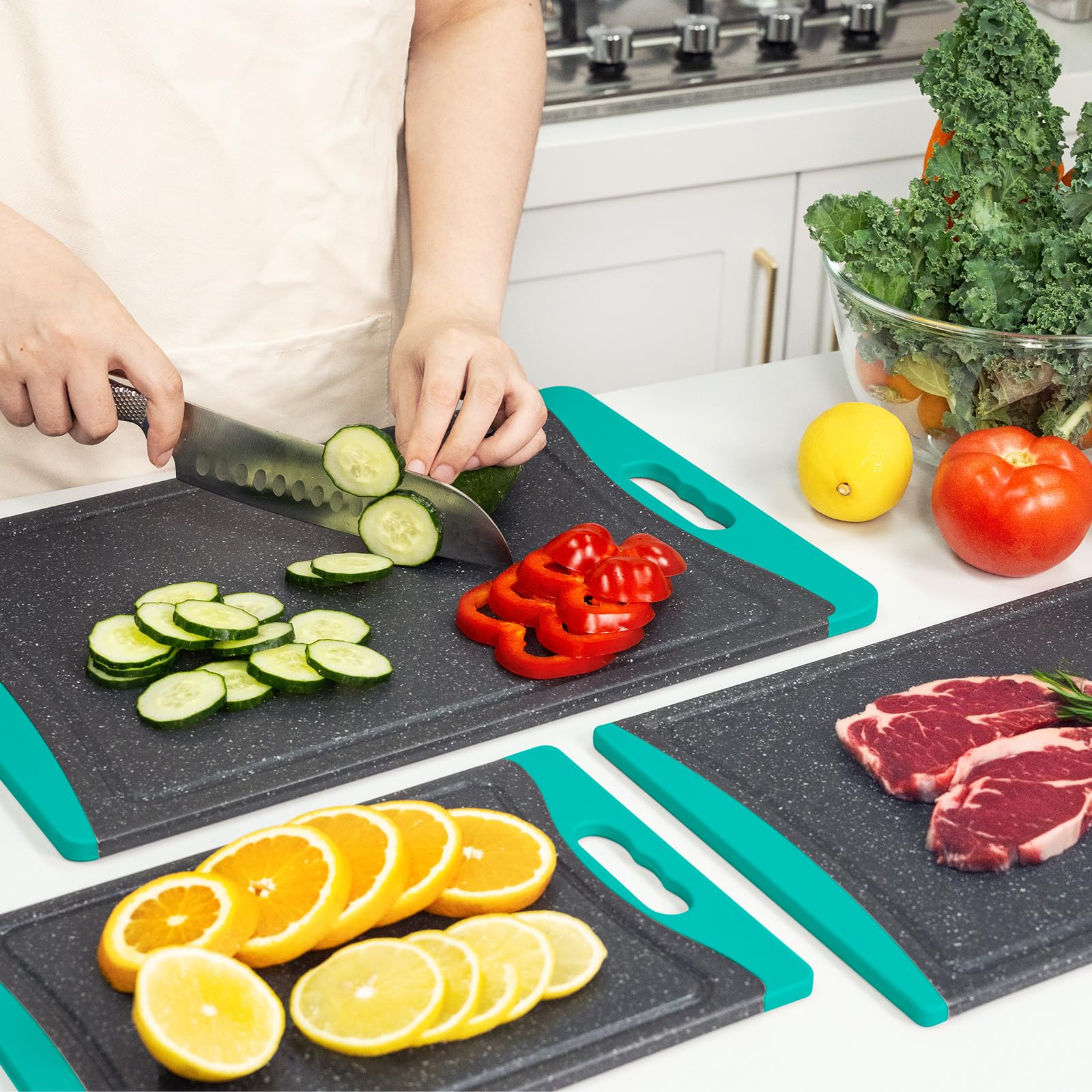 Empune set of three turquoise cutting boards stores neatly in a compact kitchen.