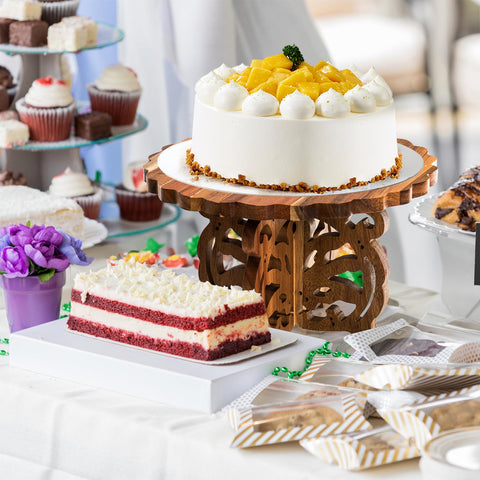 Eorbow carved base adds rustic charm to the dessert table