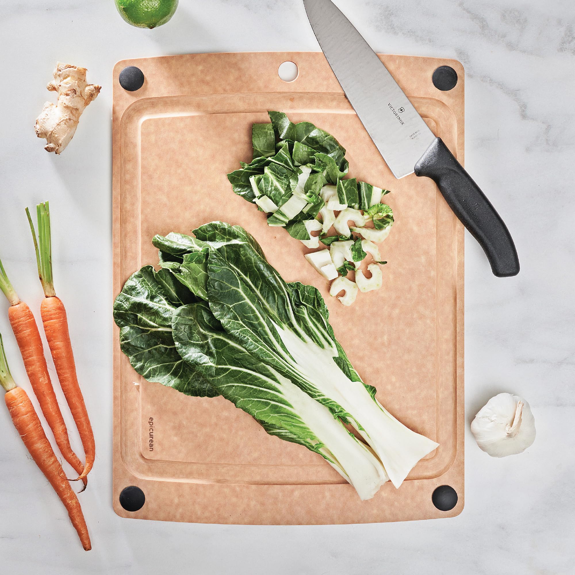 Epicurean all-in-one cutting board showing juice groove catching liquids during prep